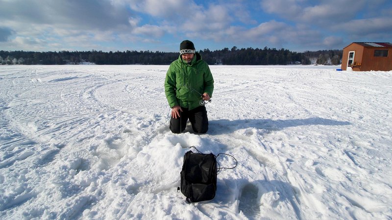 Challenging Ice Fishing in the Frozen Lakes of Canada, ice fishing gamble game